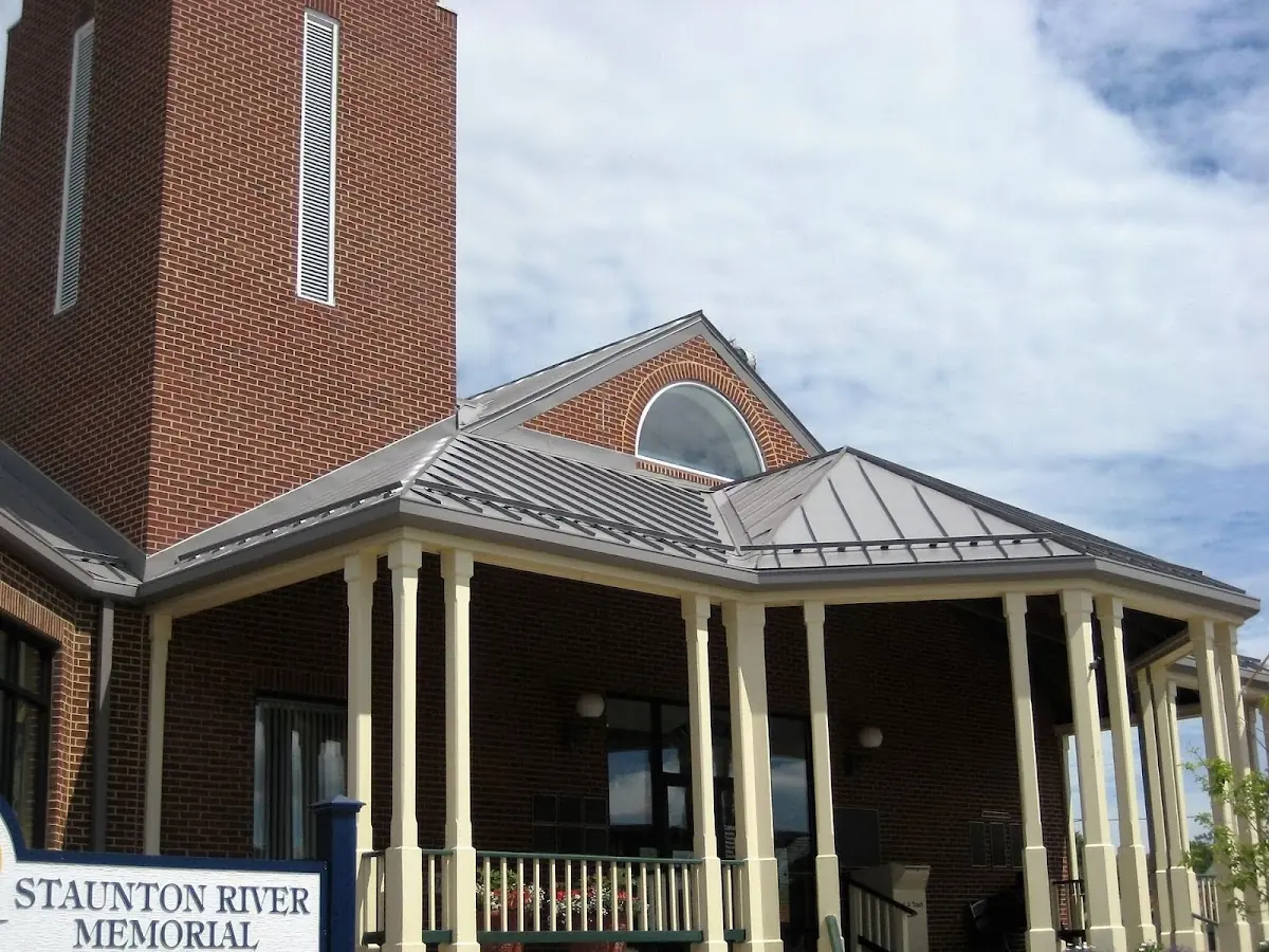 Skilled roofing craftsmen working on a residential roof in North Frogtown